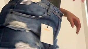 Sexy wife changes clothes in the shop dressing room