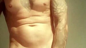 Blue-eyed tattooed amateur masturbates with monster cock solo