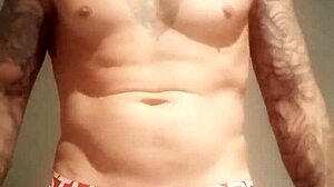 Blue-eyed tattooed amateur masturbates with monster cock solo