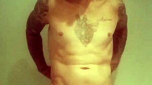 Blue-eyed tattooed amateur masturbates with monster cock solo