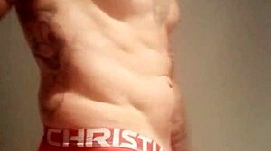 Blue-eyed tattooed amateur masturbates with monster cock solo