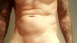 Blue-eyed tattooed amateur masturbates with monster cock solo