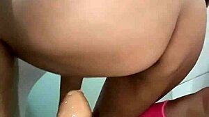 the woman enjoys using a big thick zucchini