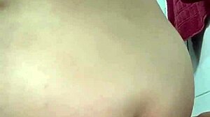 the woman enjoys using a big thick zucchini