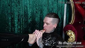 Stretched to the max, this slave endures intense femdom strapon play