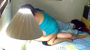cornudo spying on latina wife from another room.