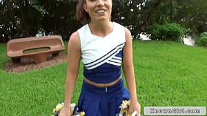 Busty cheerleader flashes outdoors with friends