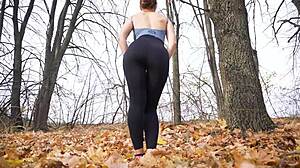 Fit milf teases sexy ass in tight black leggings at public spot
