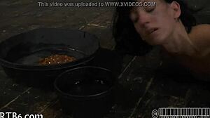 I strip in the small steel cage, ripping my clothes