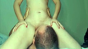 A beautiful redhead gets her pink pussy licked by an amateur couple