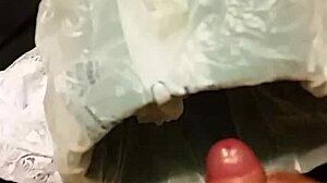 Discover the thrill of self-pleasure using wife's intimate garments in a private moment of indulgence