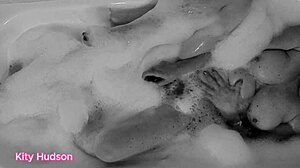 kity hudson indulges in a steamy bath with her favorite toy