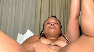 Big breasted black MILF masturbates with a toy and has a squirting orgasm