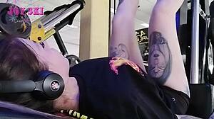 Alternative Girl Stretches At The Gym