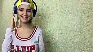 A blonde student in a classroom play with her classmate and ends up with a facial