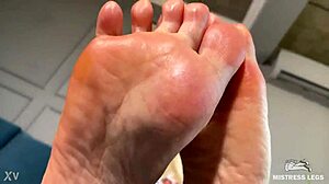 goddess teases with pink oily soles and toes closeup