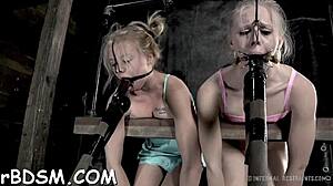 Beautiful woman in chains in hardcore BDSM scene