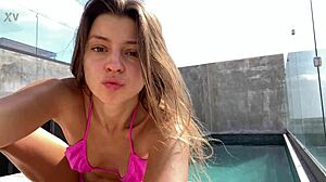 Solo girl enjoys the sun in a pink bikini