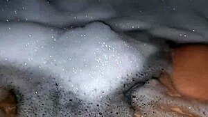 Hot relaxing bath with foam, steamy, intimate setting