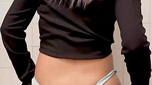 Girlfriend dances seductively in bathroom wearing pantyhose