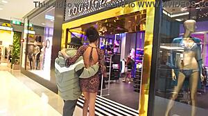 Young beautiful blonde in glasses teasing at mall