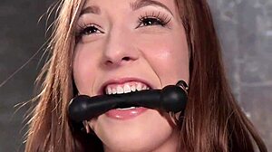 This babe with a clamped tongue endures rough fucking. Her submission to bizarre fetish play is intense.