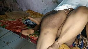 Village Bhabhi enjoys sex on the bed in a steamy scene