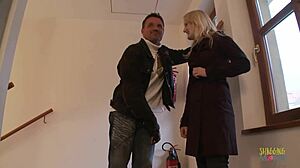 Enchanting blonde sucks cock and receives cumshots on her perfect tits in public stairwell