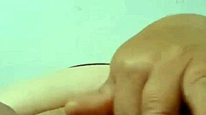 colombian grandma plays with carrot in bed