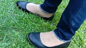 Shoeplay and dipping in action with tan nylons and flats