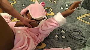 Doll in a pink robe as a unicorn is fucked from above