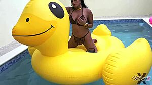 Maxine X Sunbathes In The Pool, Fingering Her Wet Pussy