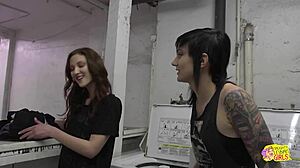 Damn! Emo babe dominates and fucks her sexy neighborhood girl with a strapon in the laundry shop!