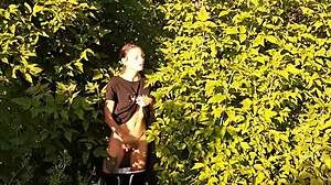Brunette feels intense orgasm from risky outdoor masturbation in nature