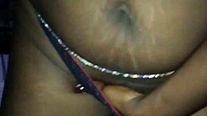 Mature milf fingers her wet pussy in erotic solo session, building to intense orgasm