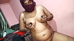 is this redhead milf fingering her asshole on the bed?