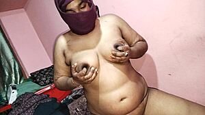 is this redhead milf fingering her asshole on the bed?