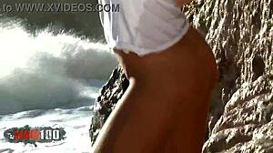 Blonde nicky wayne strips by the sea