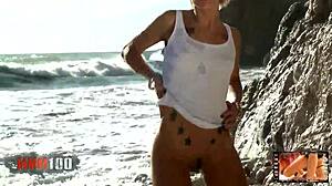 Blonde nicky wayne strips by the sea