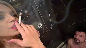 wife smokes cigarette while spending time with slave