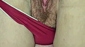 red thong teases big ass cheeks and wet pussy lips, inviting fingers to explore hidden desires