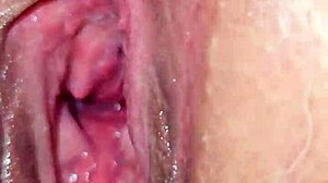 red thong teases big ass cheeks and wet pussy lips, inviting fingers to explore hidden desires