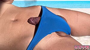 dicks poking out of swimsuits during secret school masturbation and handjob on beach.