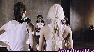 Lesbian teens eat out in locker room threesome.