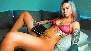 fully tattooed barbie chick chats on webcam in cosplay