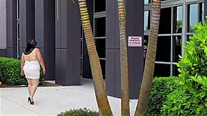 busty milf flashes pussy in office