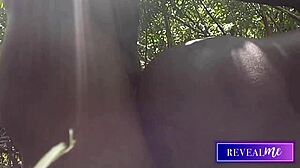 Black gay couple passionately strokes monster cocks in forest anal fuckfest.