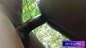 Black gay couple passionately strokes monster cocks in forest anal fuckfest.