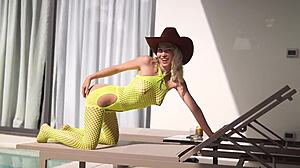 this skinny blonde young girl with brown eyes saddles a stallion smoothly with her mature friend watching