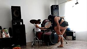 She strips and dances showing her ass while they drum! 🔥